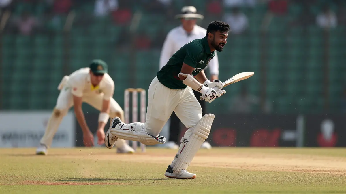 Wicketkeeper-batter in white kit completing a drive through the off side during a Test match practice or match session